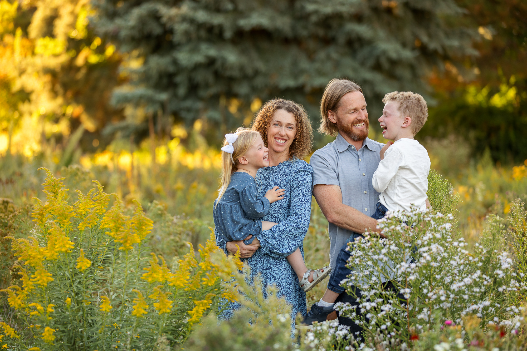 a family laughing during a portrait session in Boise, Idaho with Tiffany Hix Photography