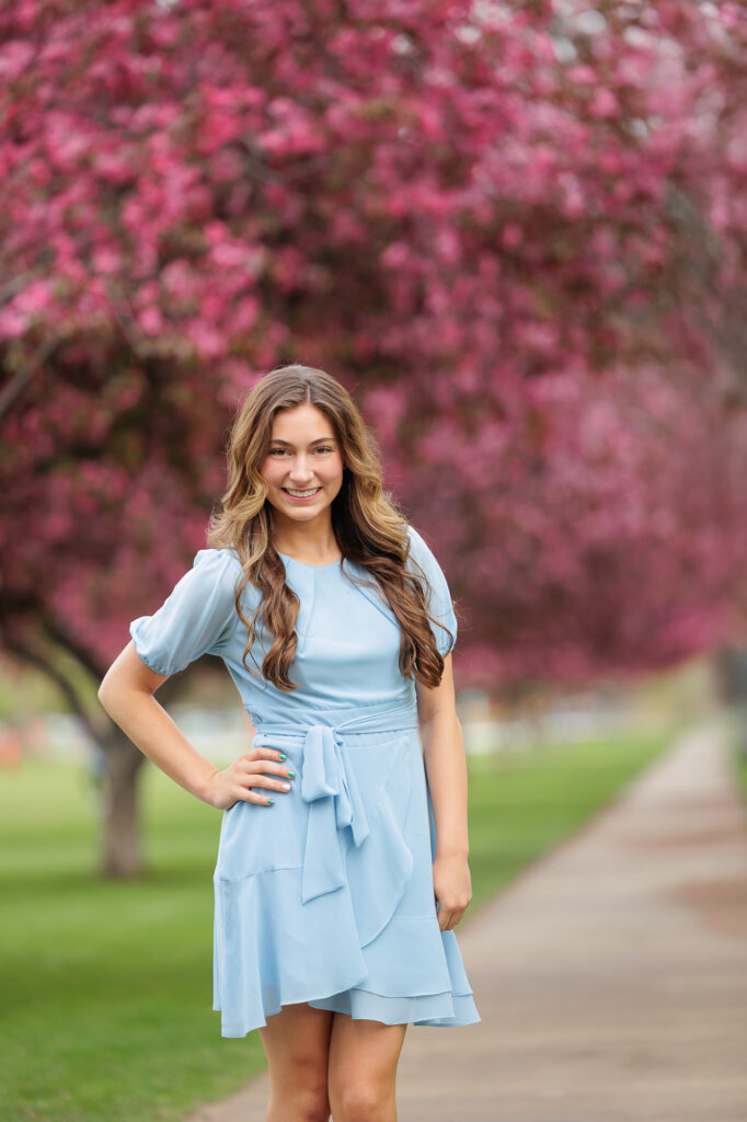 Girl standing on tree lined path at Ann Morrison Park in Boise.